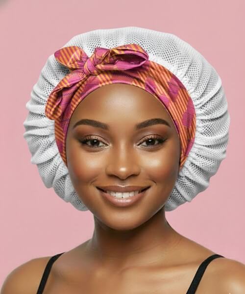 White lattice adjustable tie satin sleep bonnet with Aztec Afrique trim, providing breathable overnight protection for all hair textures.