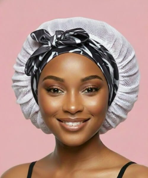 Adjustable tie satin hair bonnet with Marble Noir band and white lattice body, offering customizable fit for secure overnight hair protection while sleeping.